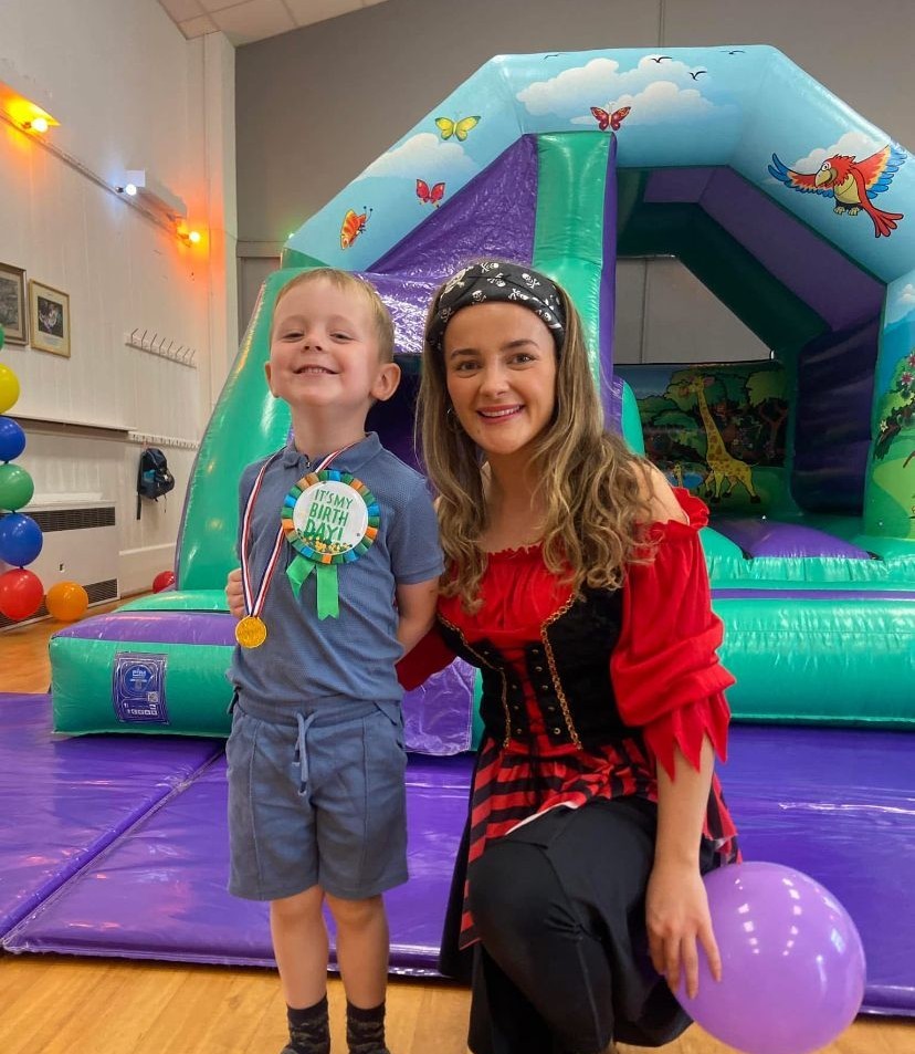 Party entertainer and child at a pirate themed party